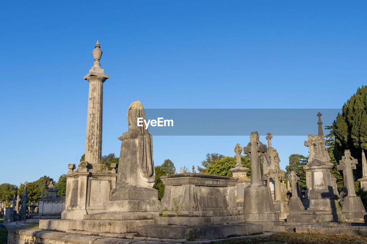 Ruins of temple against clear blue sky