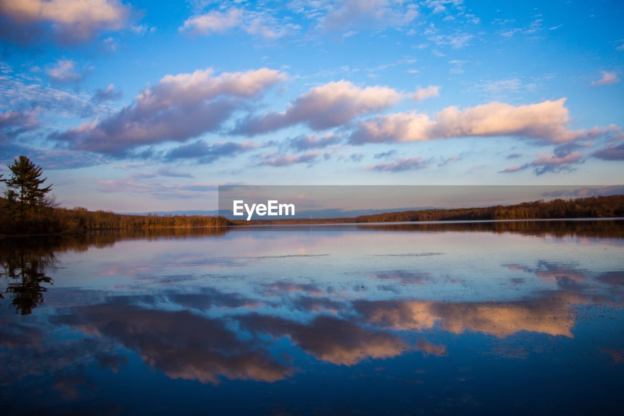 Scenic view of lake against sky during sunset