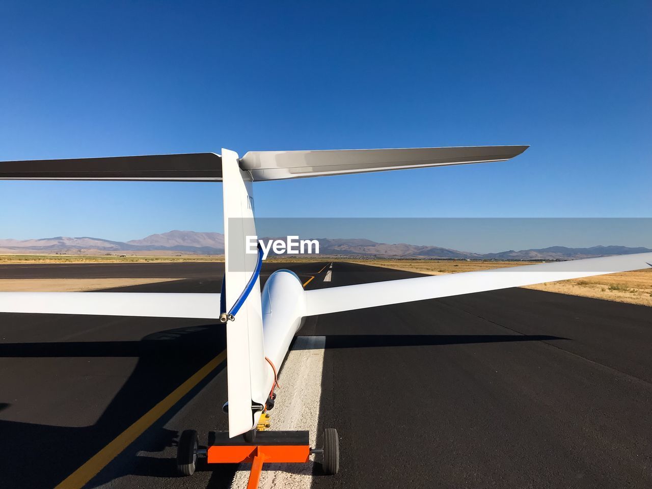 AIRPLANE WING AGAINST SKY