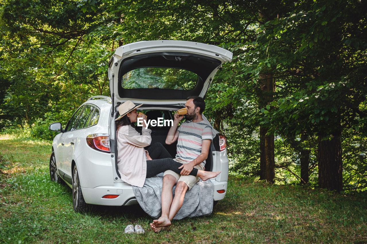 WOMAN SITTING IN CAR