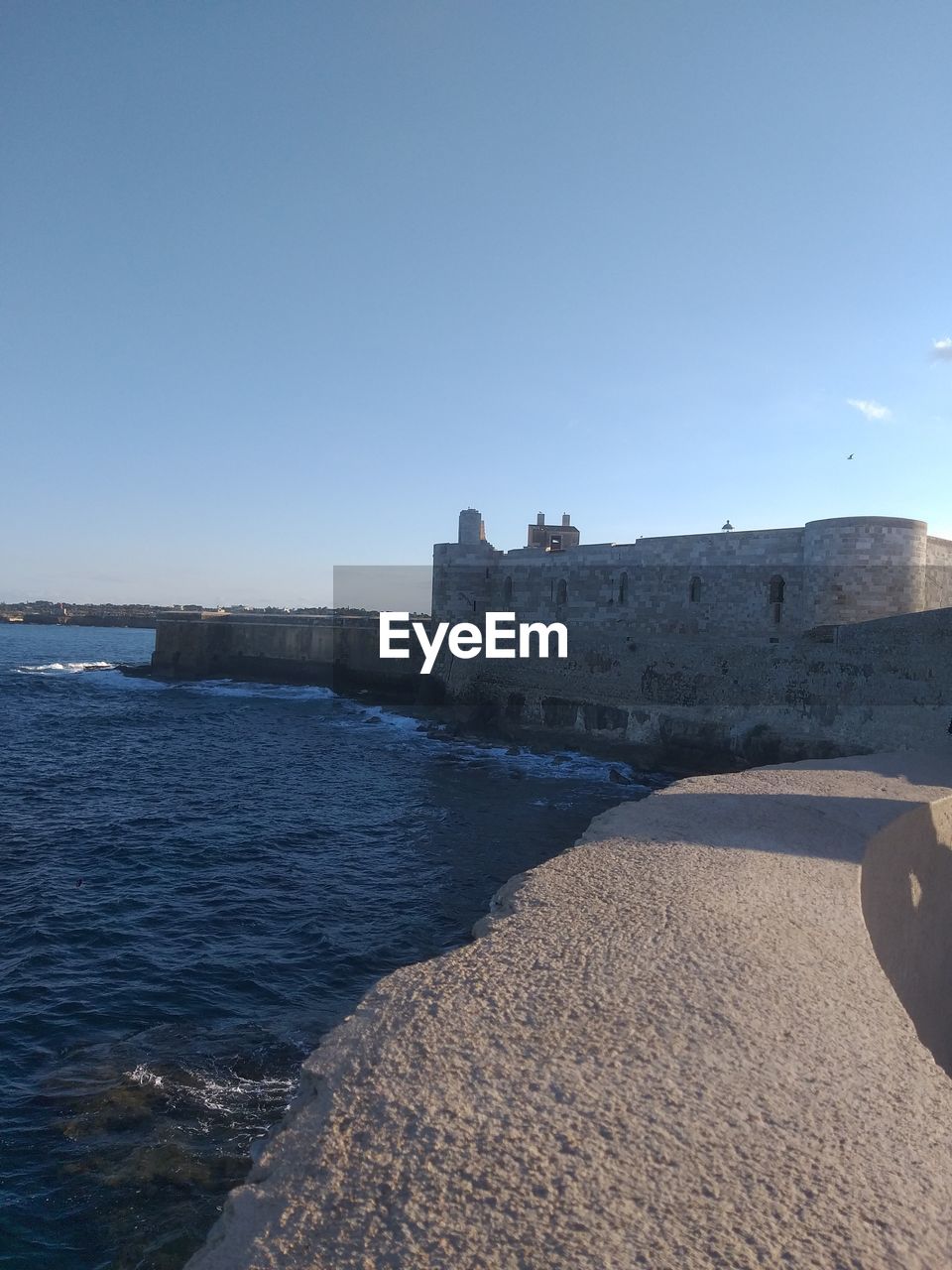 SCENIC VIEW OF BEACH AGAINST CLEAR SKY
