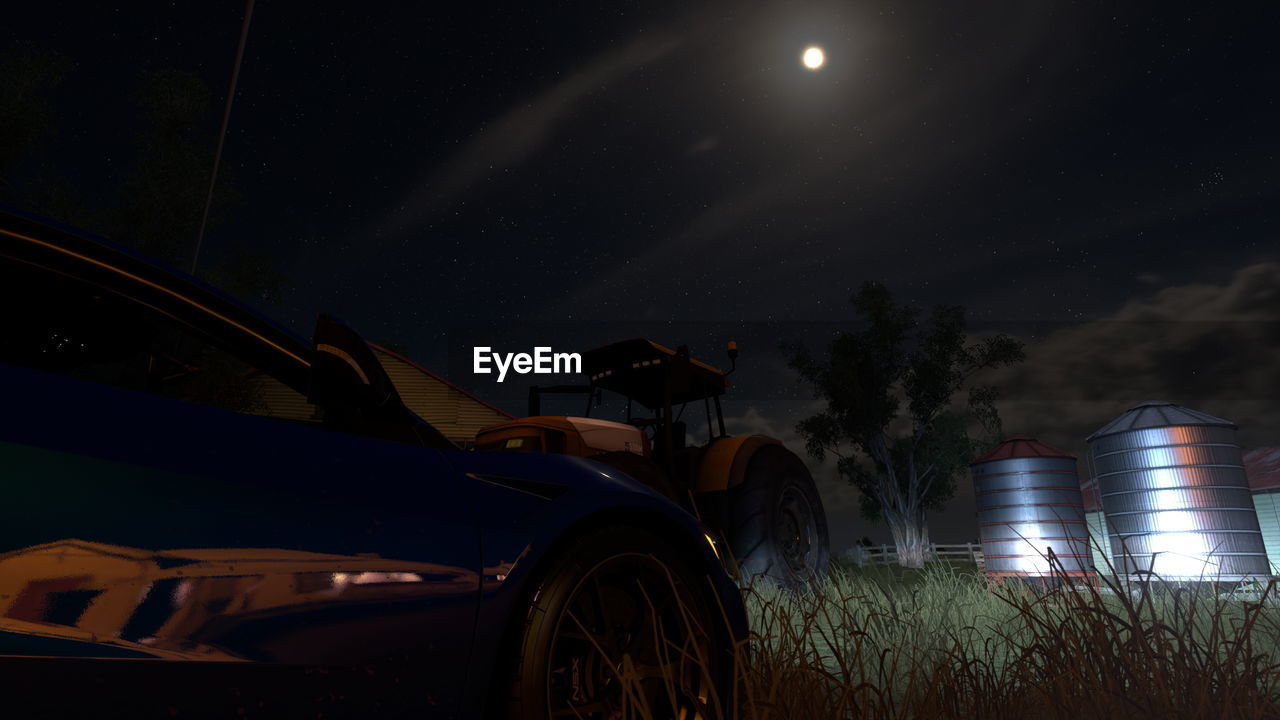 CAR ON FIELD AT NIGHT