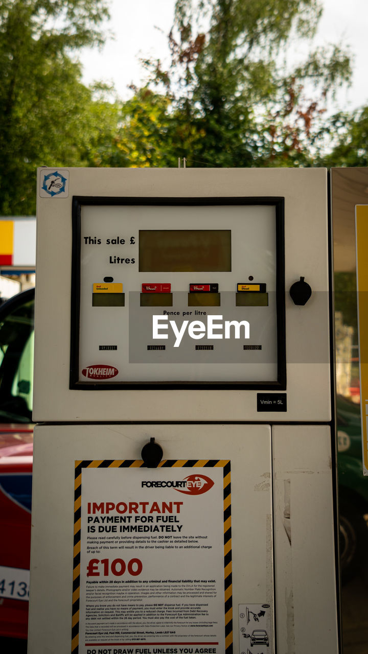 power generation, fuel pump, text, technology, communication, no people, fossil fuel, gas station, sign, industry, western script, gasoline, tree