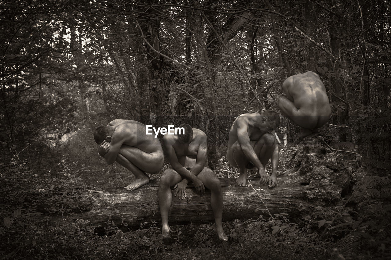 Multiple image of naked man sitting on fallen tree in forest