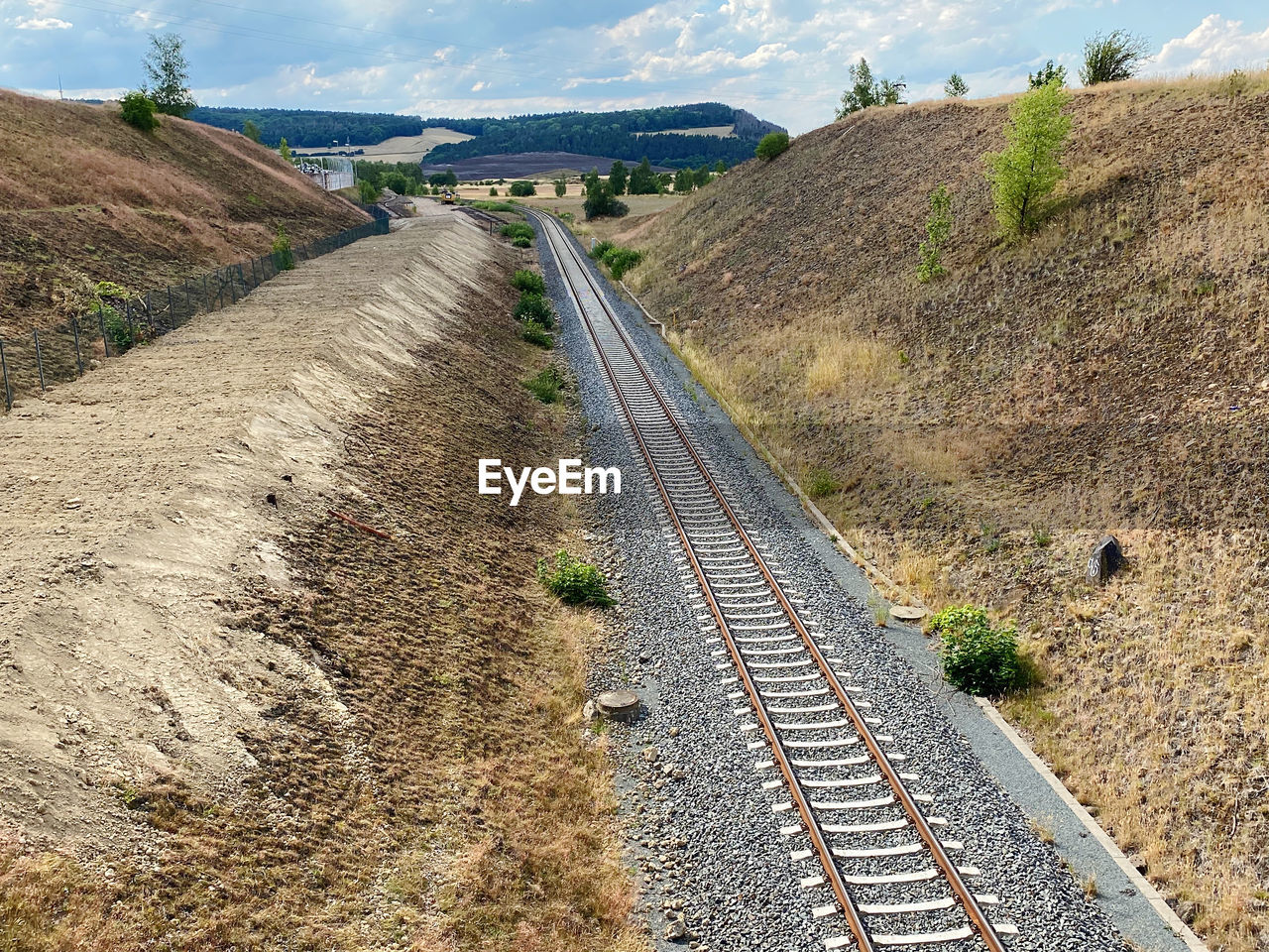 Railroad track amidst field