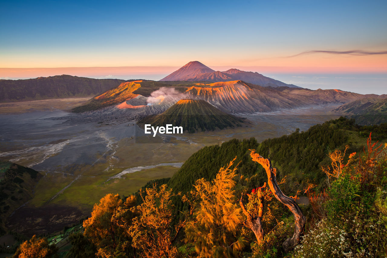 Scenic view of volcano at bromo-tengger-semeru national park against sky during sunset