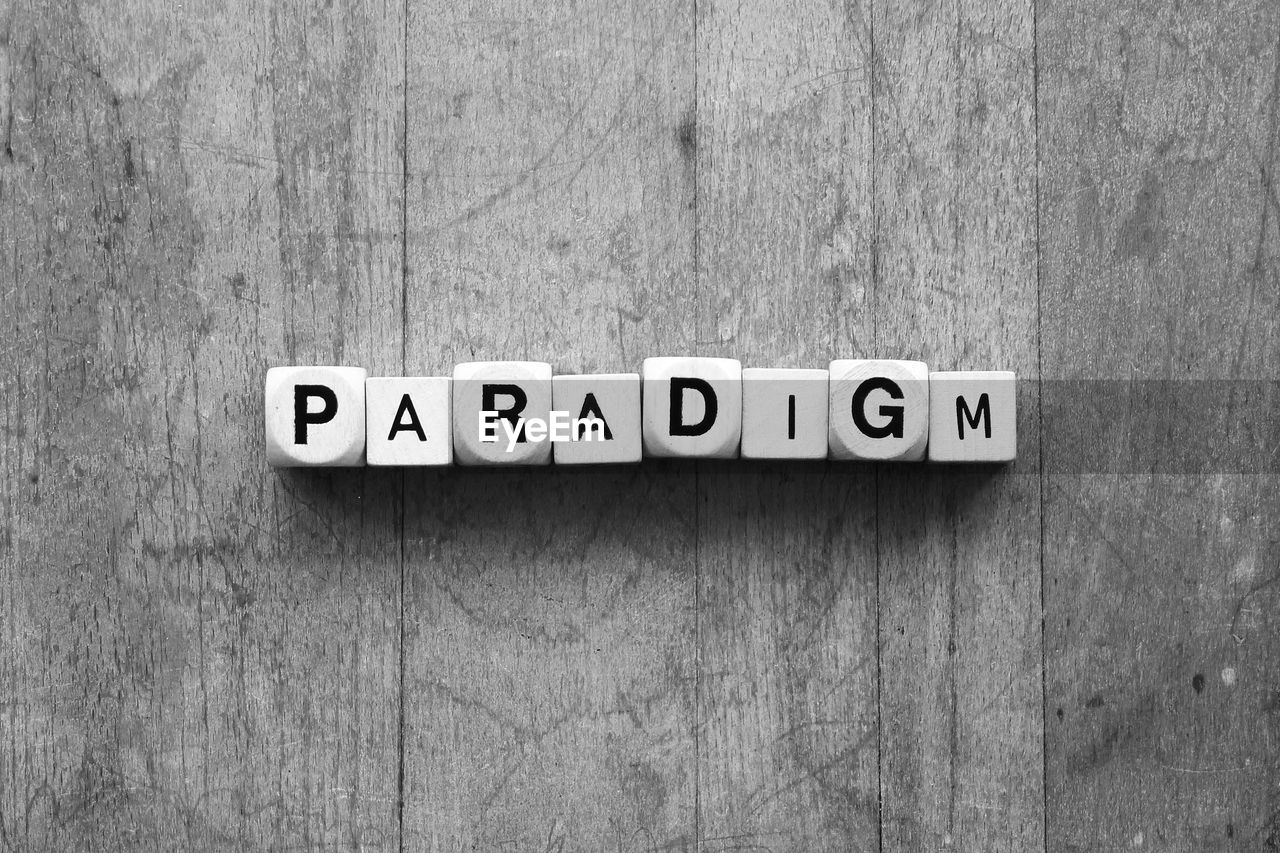 "paradigm" - embossed cube letters