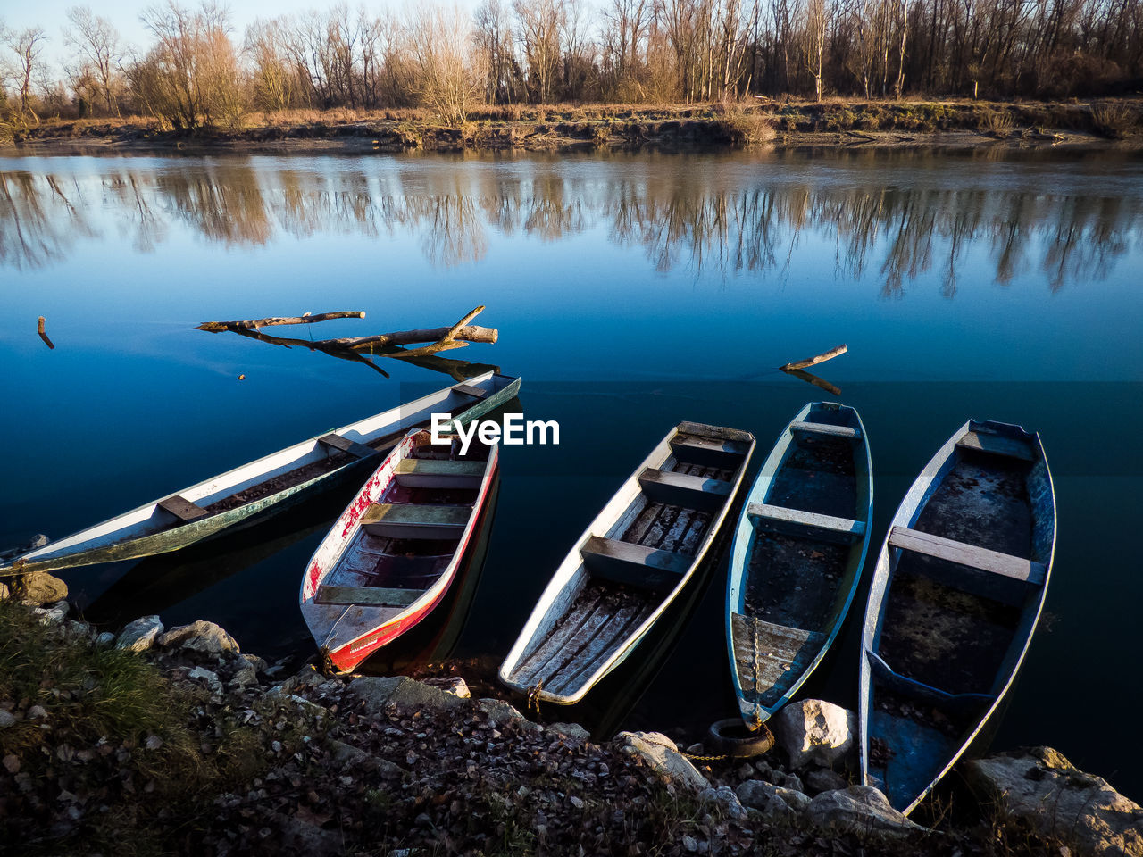 Boats moored on lake