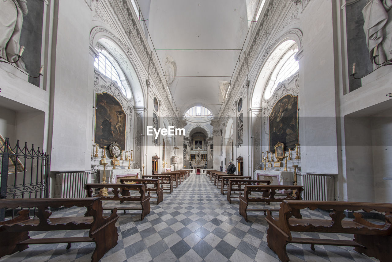 architecture, aisle, seat, indoors, building, place of worship, arch, built structure, religion, arcade, table, chair, belief, spirituality, catholicism, no people, history, the past, estate, furniture, travel destinations, worship, pew, travel, flooring, interior design
