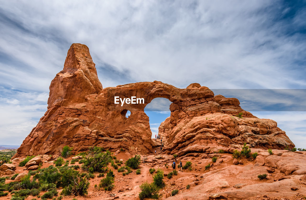 Low angle view of rock formation against sky