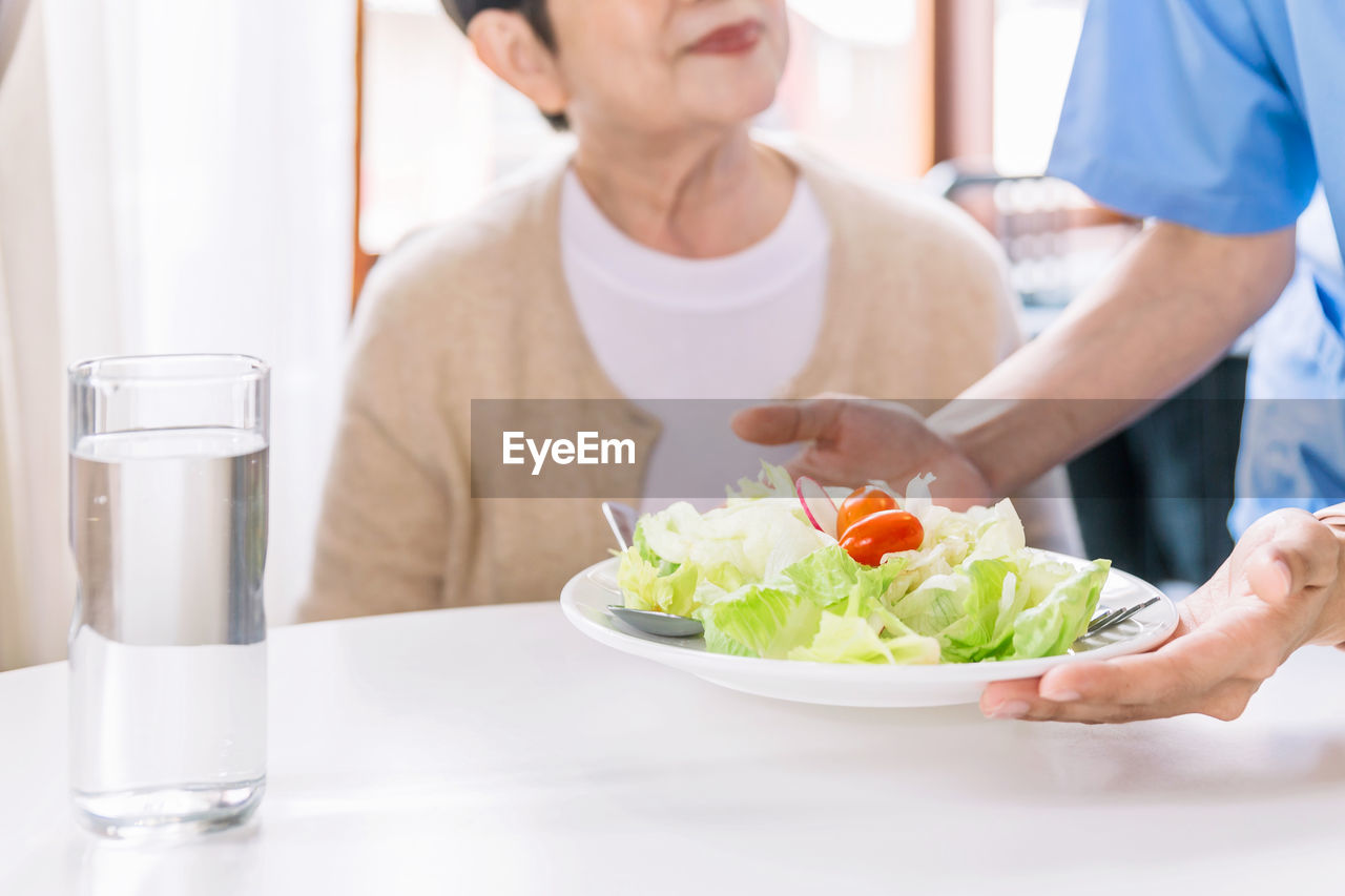 midsection of woman having breakfast