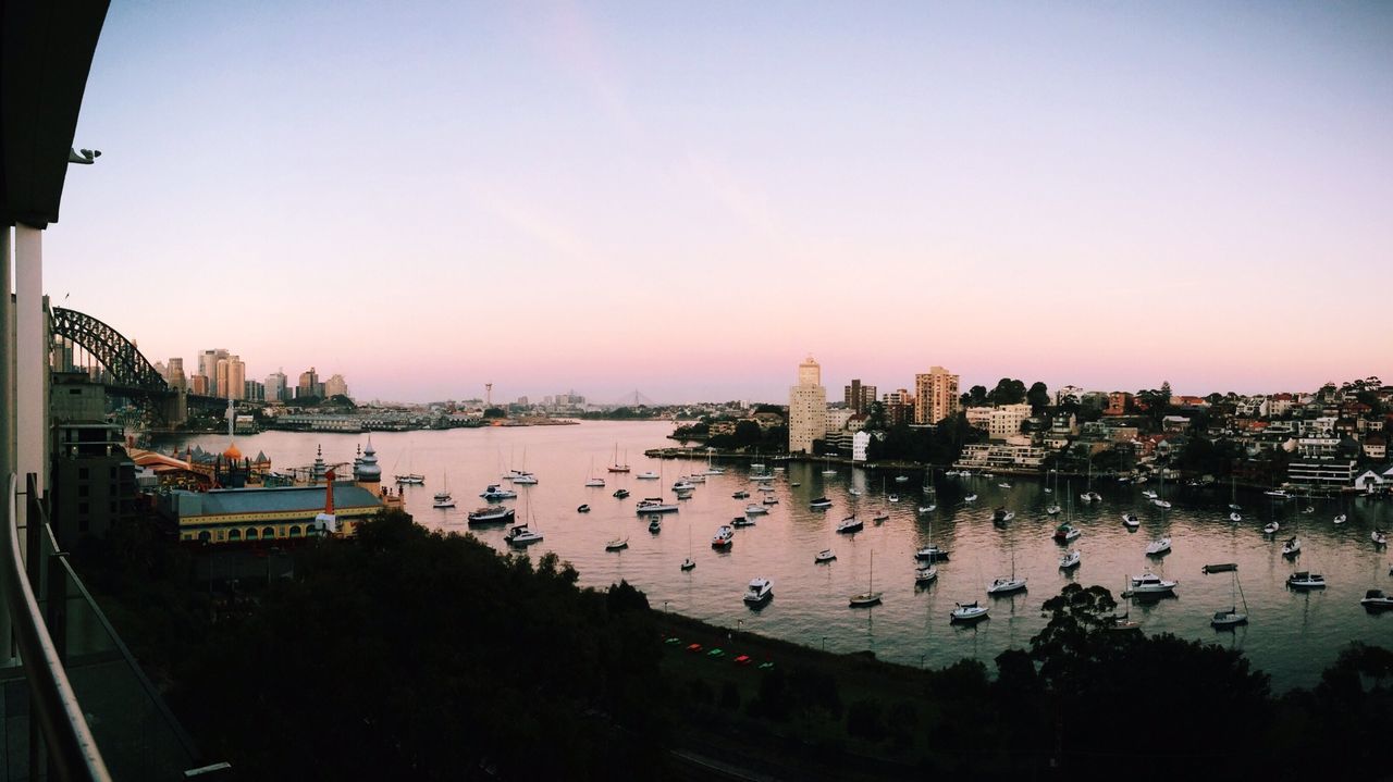 High angle view of nautical vessels and building against clear sky