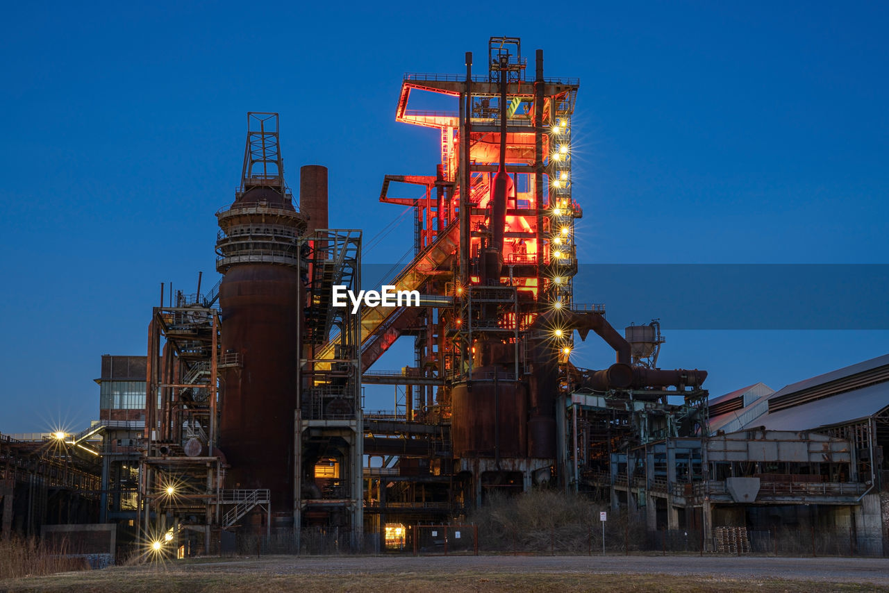 industry, power generation, oil industry, fossil fuel, architecture, petroleum, oil, sky, refinery, built structure, blue, business finance and industry, business, gasoline, transport, nature, factory, night, no people, natural gas, technology, outdoors, vehicle, filling, equipment, pipe - tube, metal
