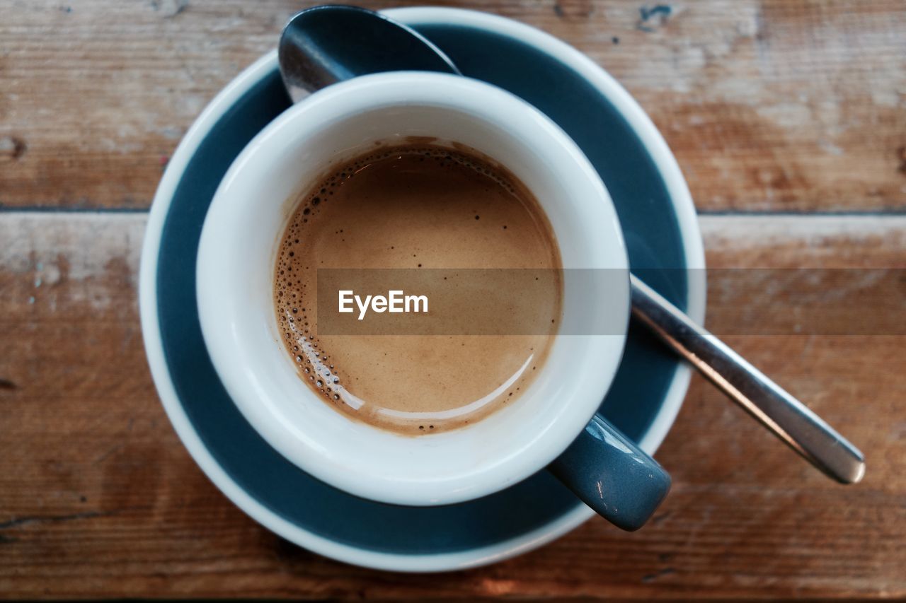 CLOSE-UP OF COFFEE CUP ON TABLE