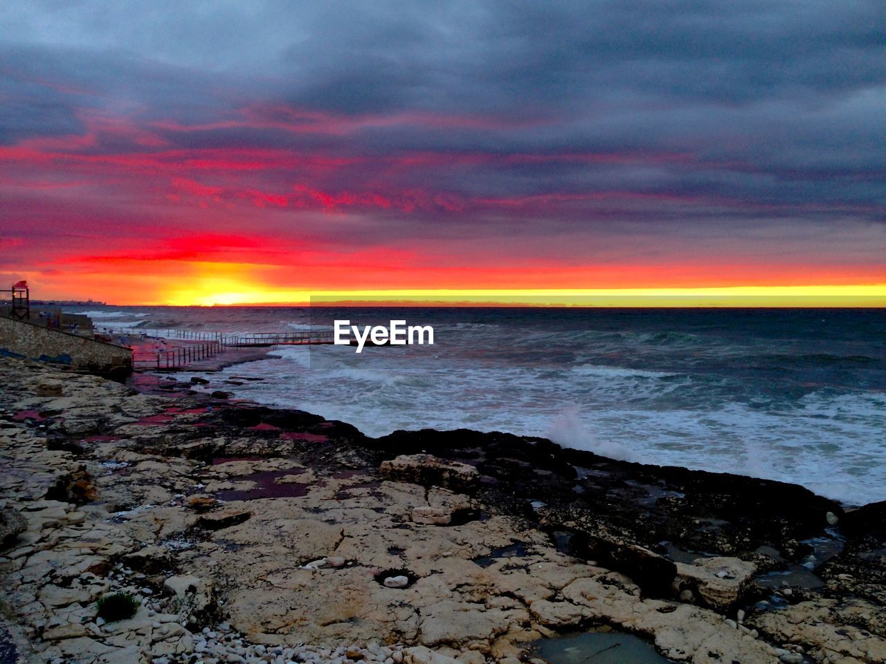 View of calm sea at sunset