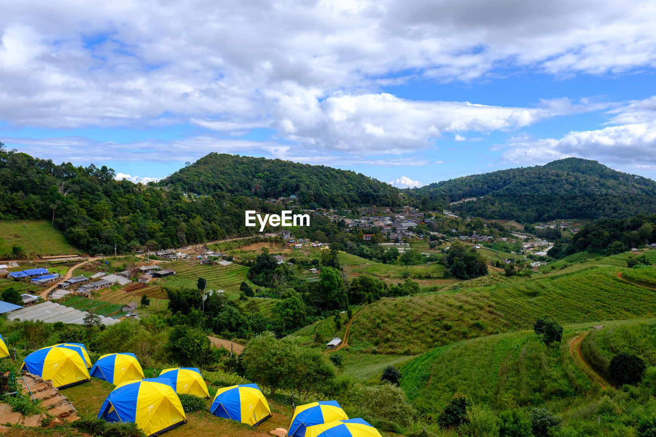 SCENIC VIEW OF TREE MOUNTAINS AGAINST SKY