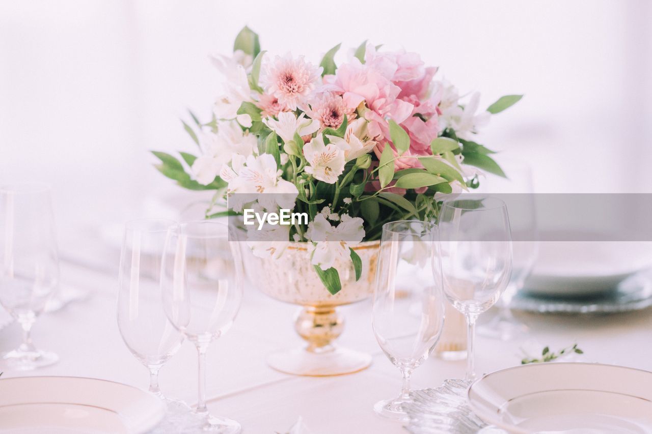 Flower vase on table at restaurant