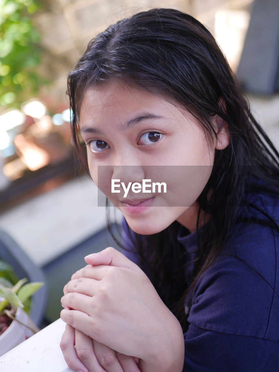 Close-up of young woman using mobile phone