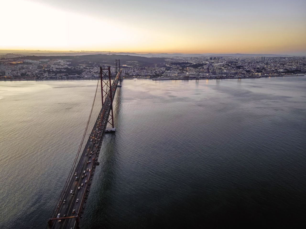 HIGH ANGLE VIEW OF BRIDGE AGAINST SKY DURING SUNSET