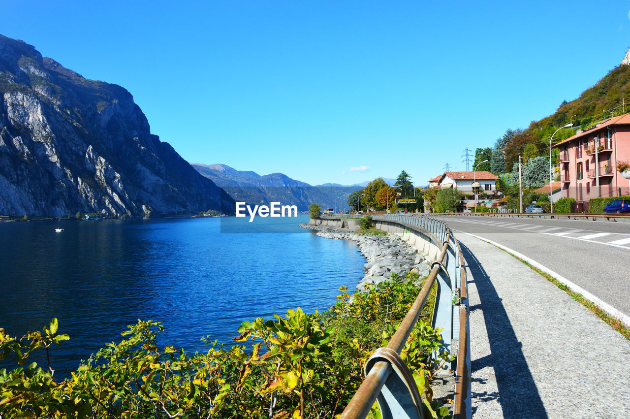 Scenic view of mountains against clear blue sky