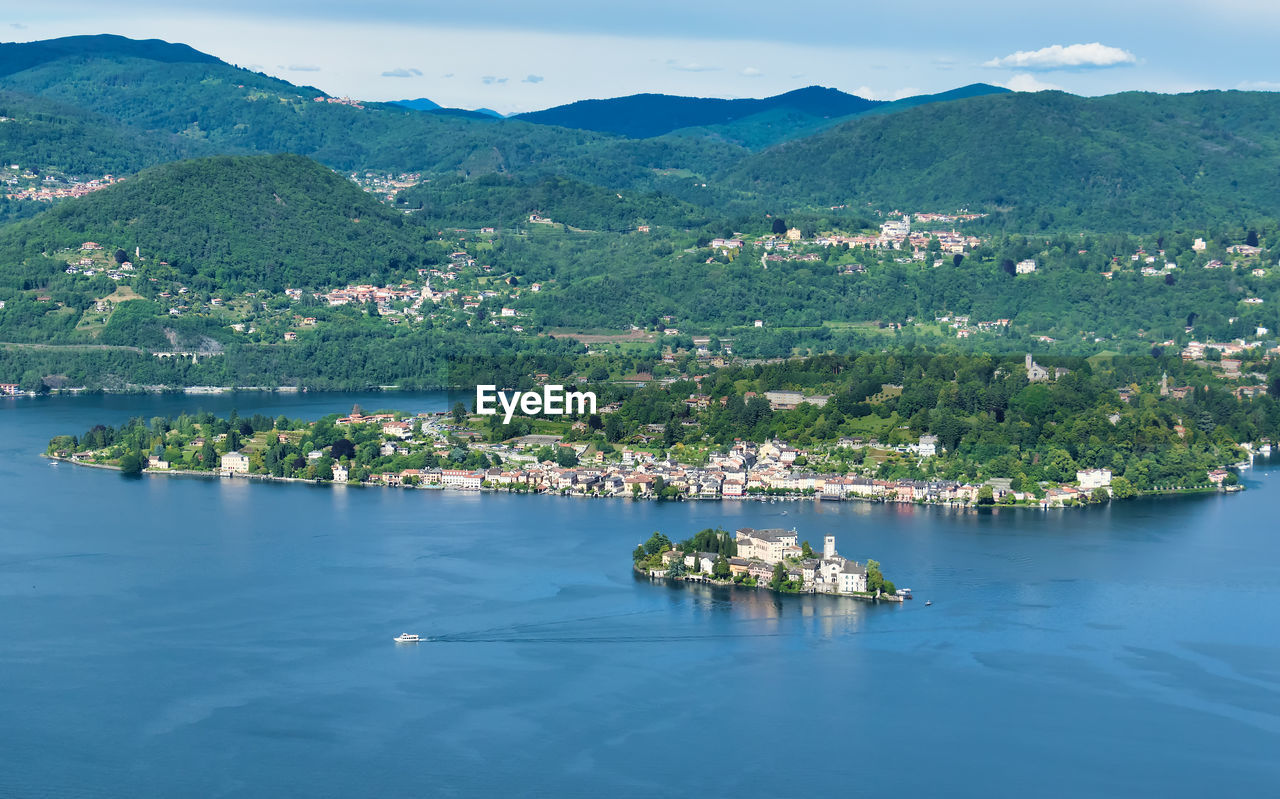 High angle view of sea by mountain