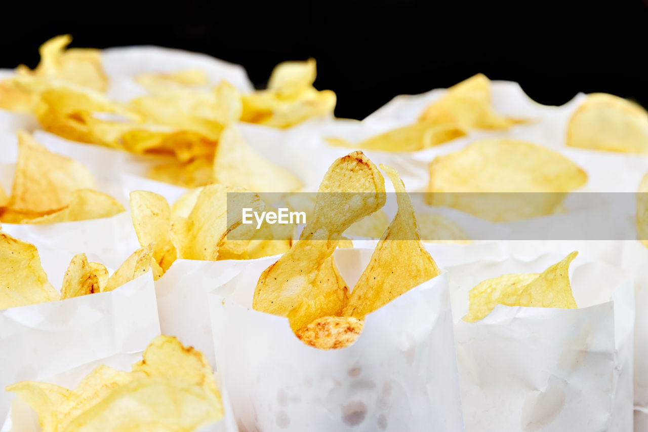 Traditional potato chips on a craftsman image.