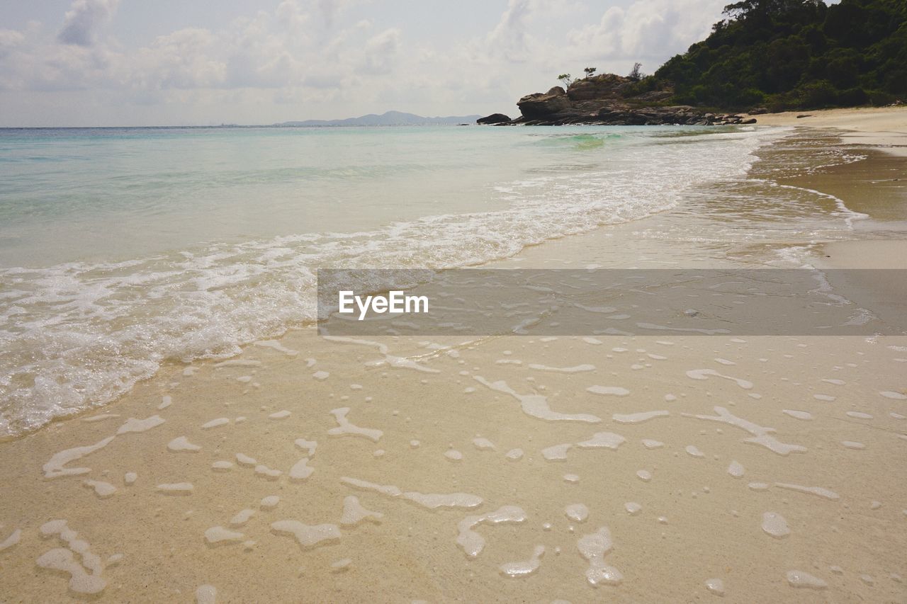 Scenic view of beach against sky