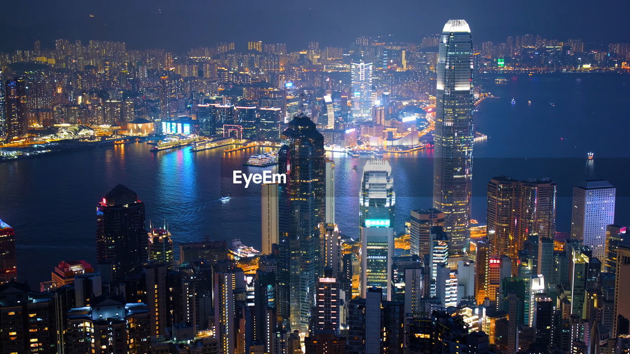 Illuminated modern buildings in city at night, hongkong building and landscape