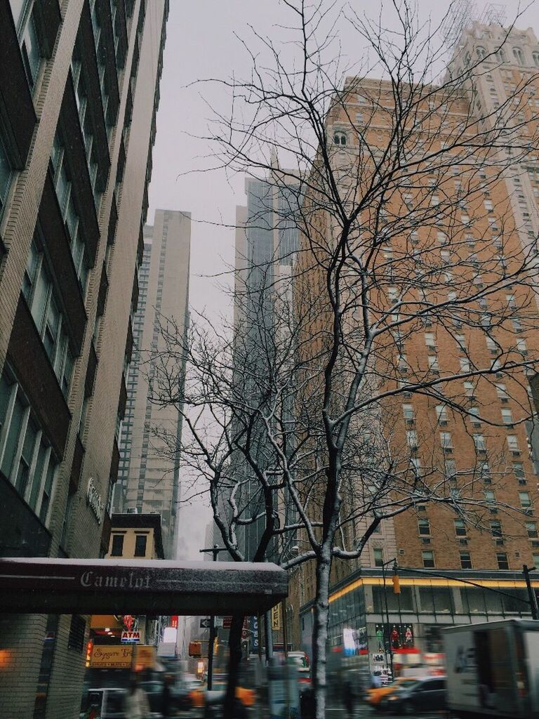 CARS ON ROAD IN CITY