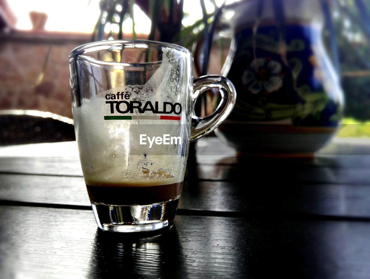 CLOSE-UP OF COFFEE AND JUICE ON TABLE