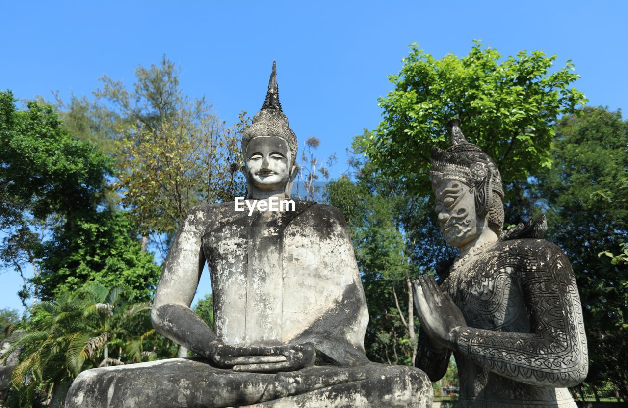 STATUE AGAINST SKY