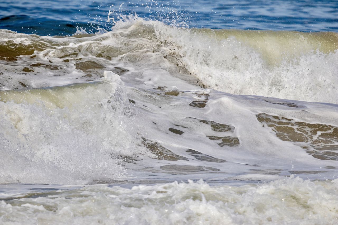 WAVES SPLASHING ON BEACH