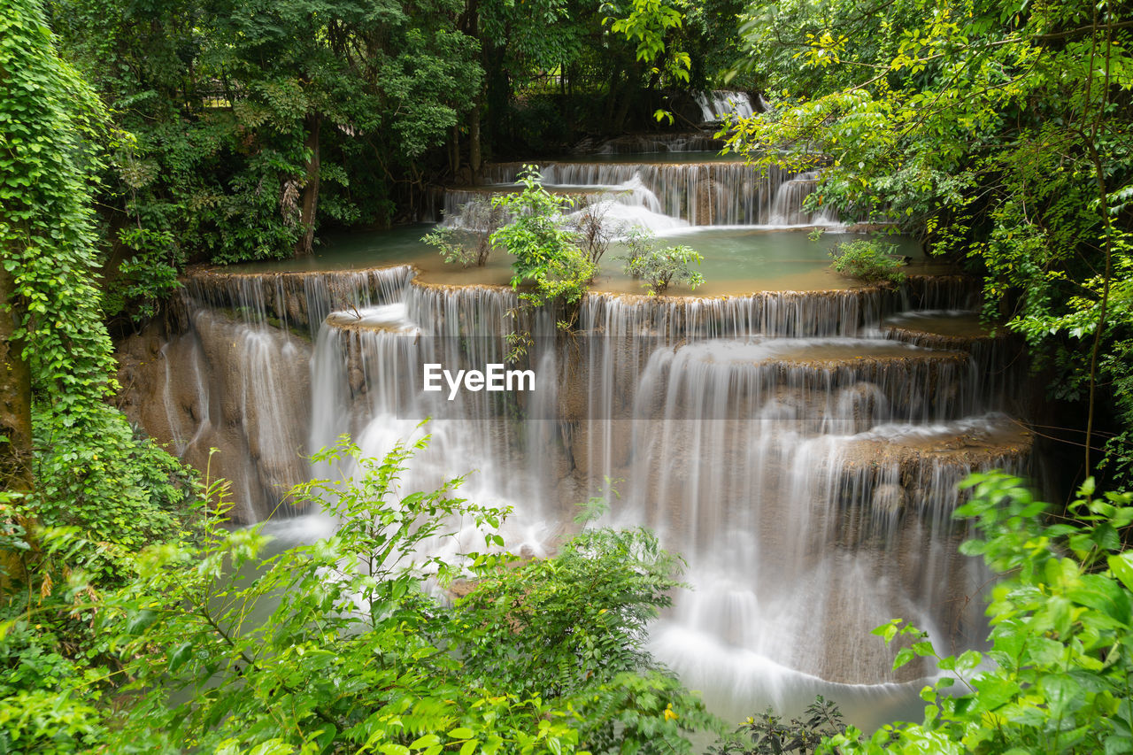 waterfall, water, plant, beauty in nature, tree, scenics - nature, watercourse, nature, body of water, motion, environment, forest, long exposure, flowing water, land, water feature, environmental conservation, rainforest, no people, flowing, green, jungle, outdoors, non-urban scene, blurred motion, travel destinations, foliage, growth, lush foliage, water resources, stream, tourism, travel, river, social issues, idyllic, freshness, splashing, state park, rock, landscape, tropical climate, power in nature, day