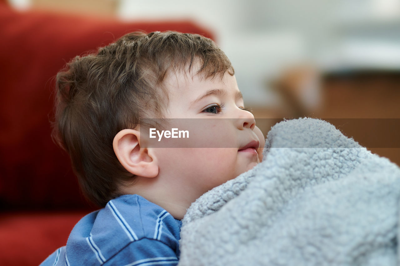 Portrait of a cute young boy and his safety blankie