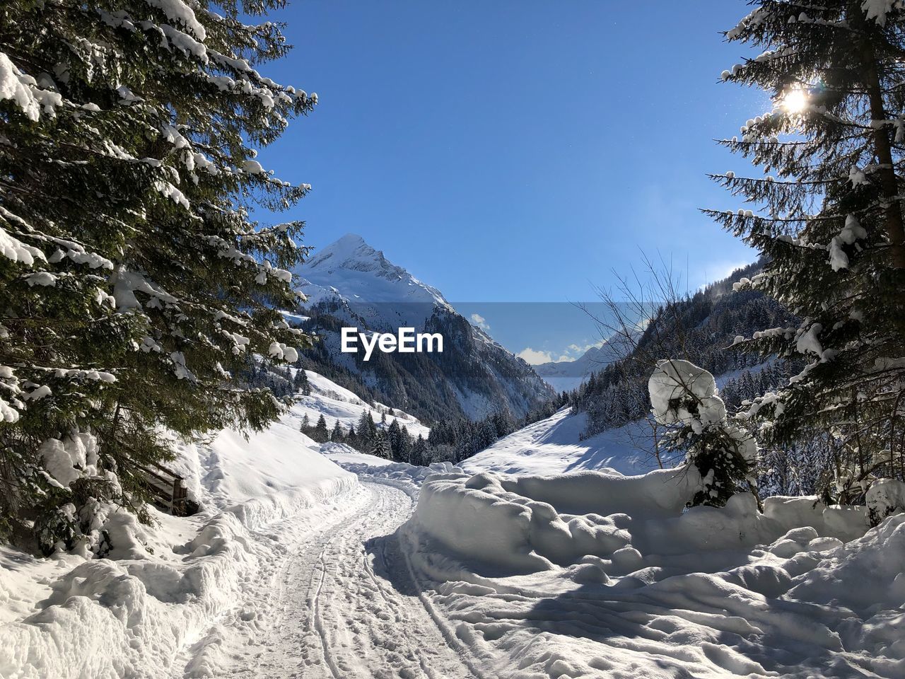 Scenic view of snow covered mountains against sky