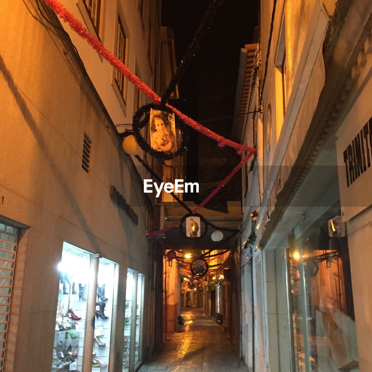 STREET LIGHTS IN ILLUMINATED CITY AT NIGHT