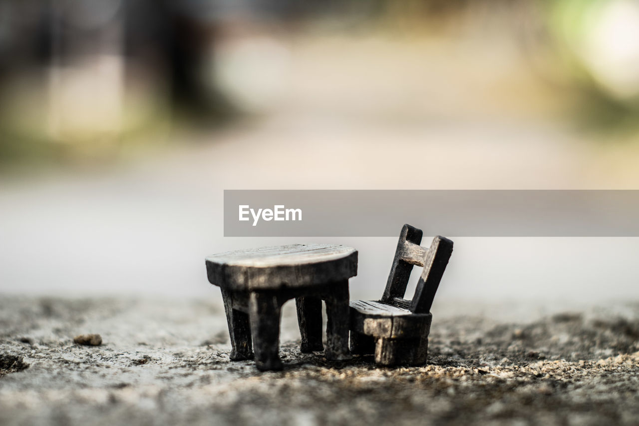 CLOSE-UP OF OLD METAL ON TABLE