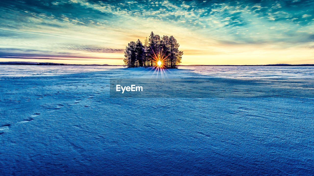 Scenic view of landscape against sky during sunset