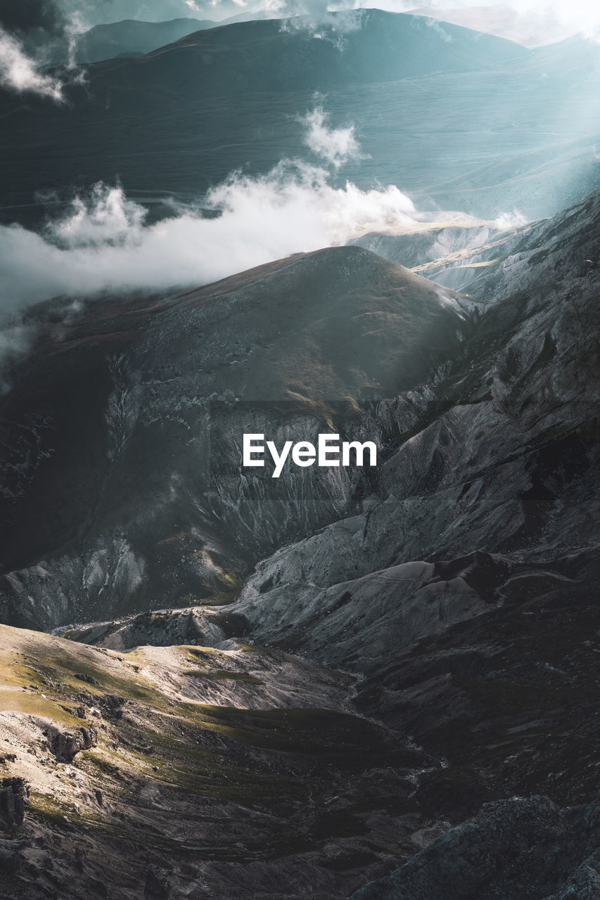 High angle view of snowcapped mountains and sea