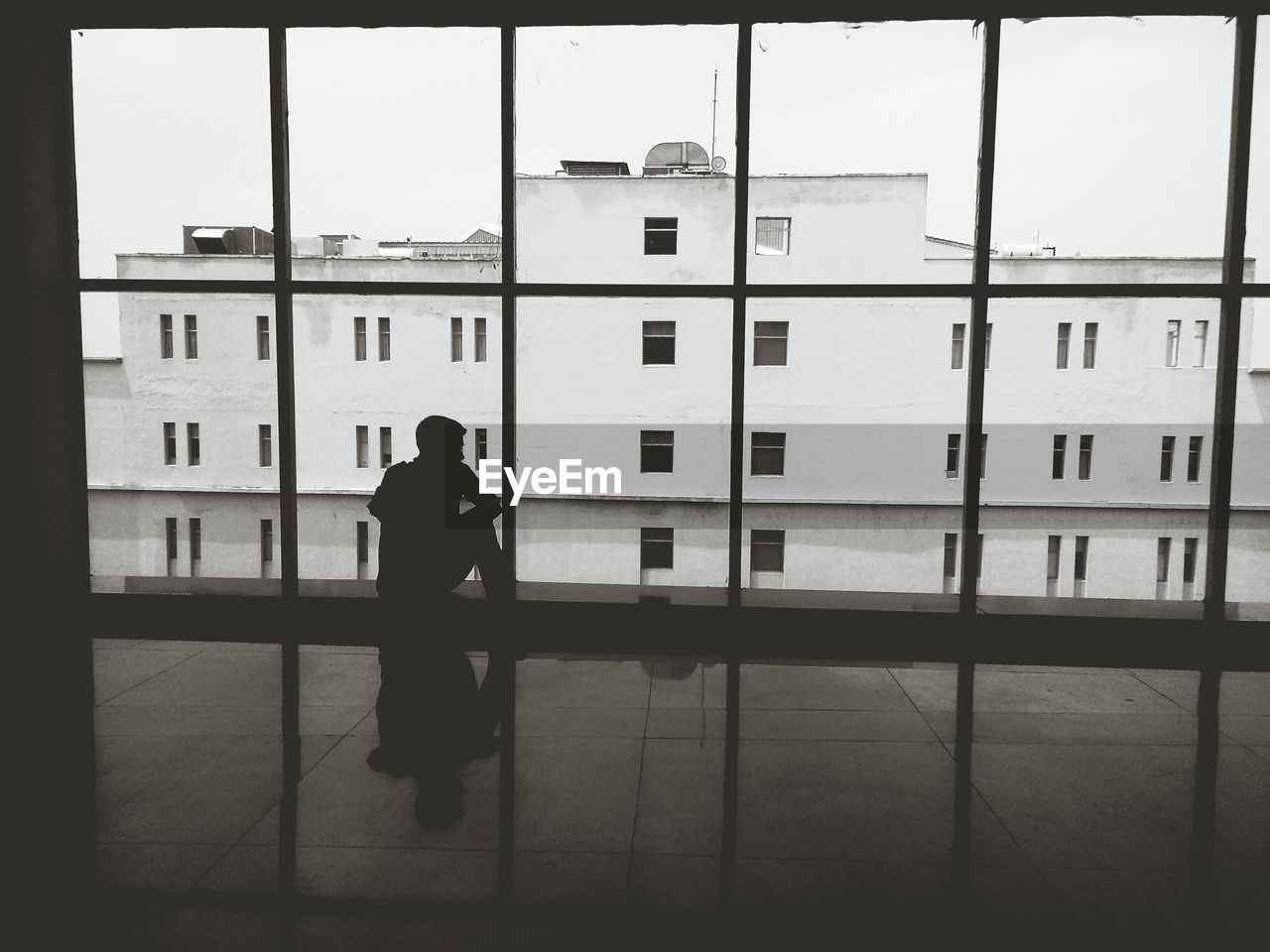 Man looking out of loft window