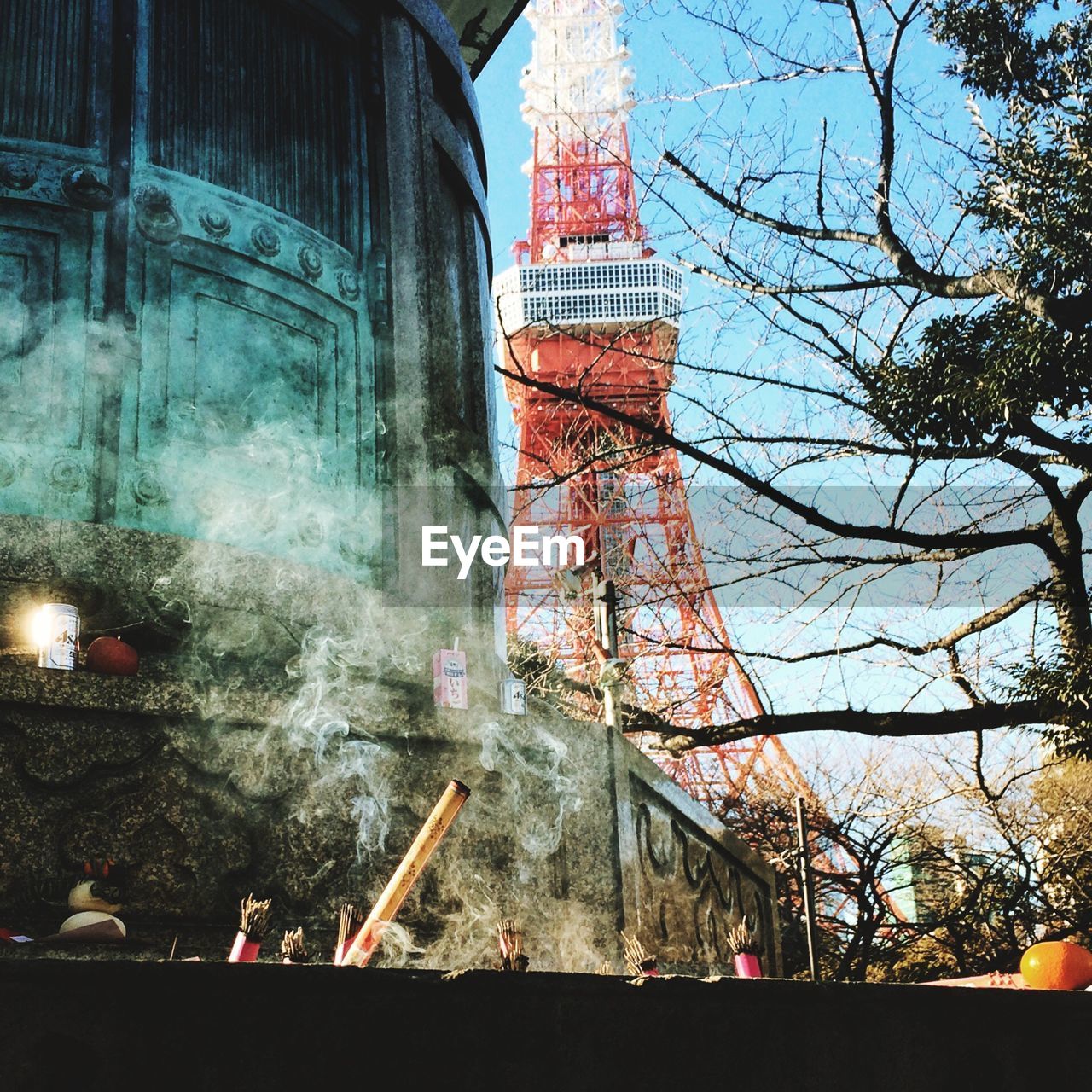 Low angle view of tokyo tower and building in city