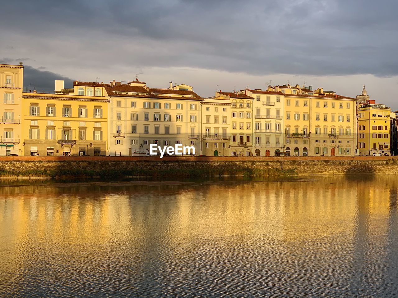 REFLECTION OF BUILDINGS IN RIVER