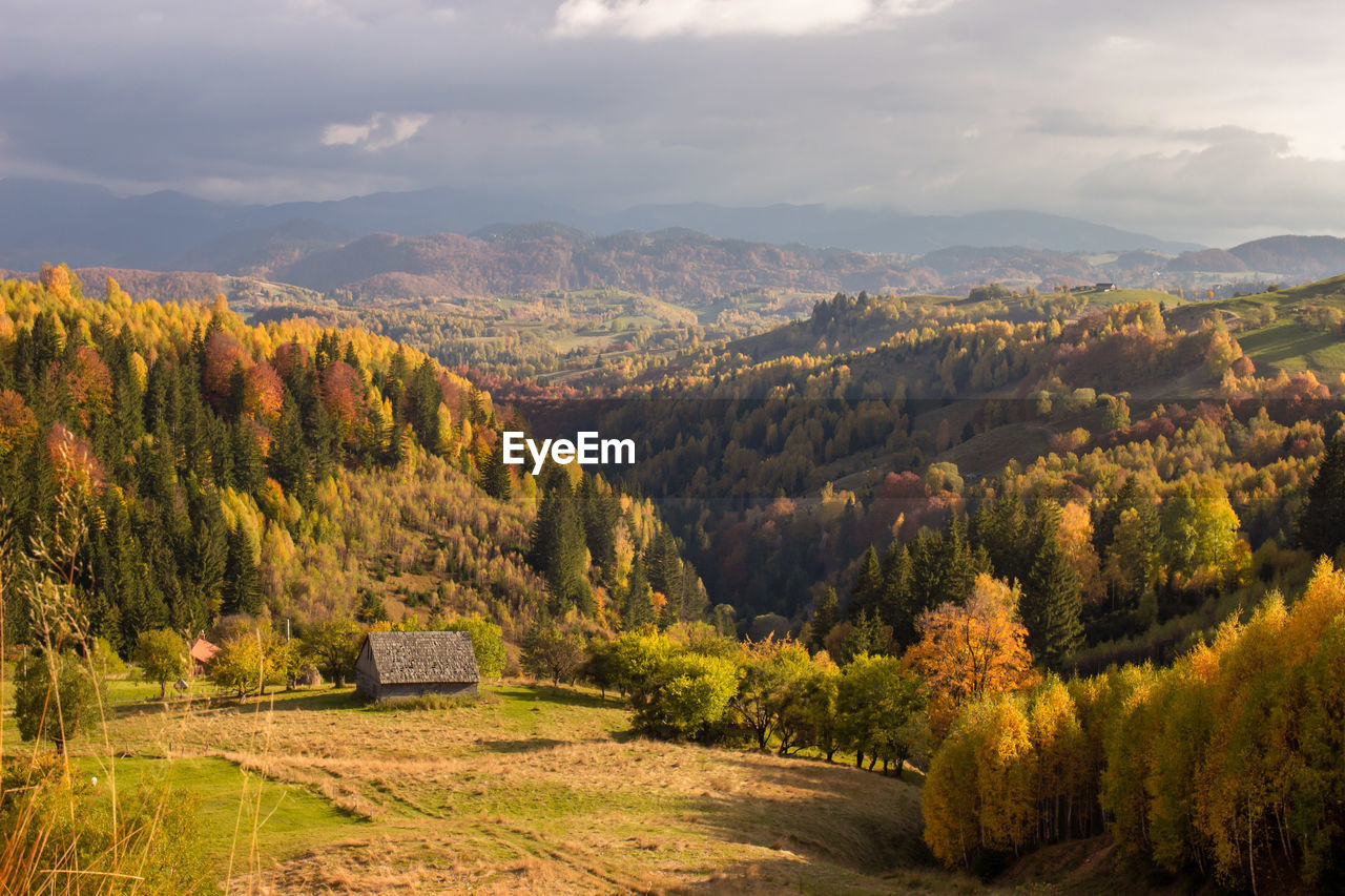 high angle view of trees and mountains against sky