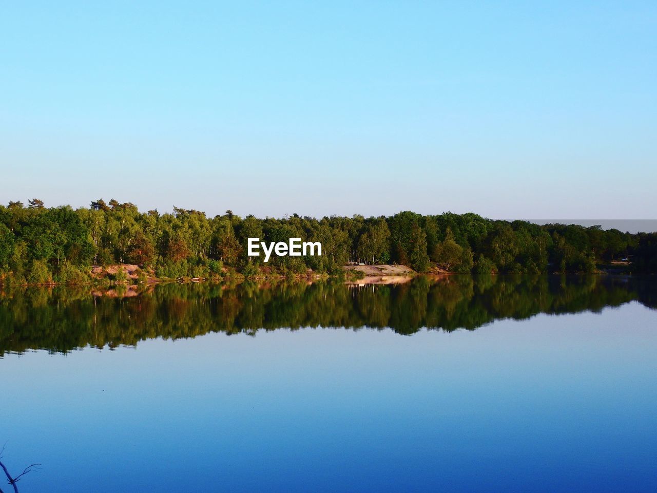 SCENIC VIEW OF LAKE AGAINST CLEAR SKY