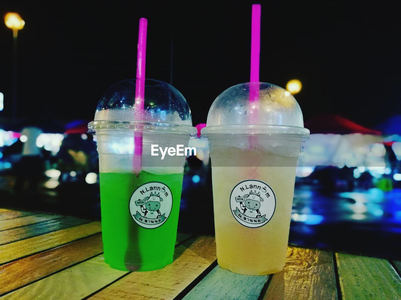 CLOSE-UP OF DRINK SERVED ON TABLE AT NIGHT