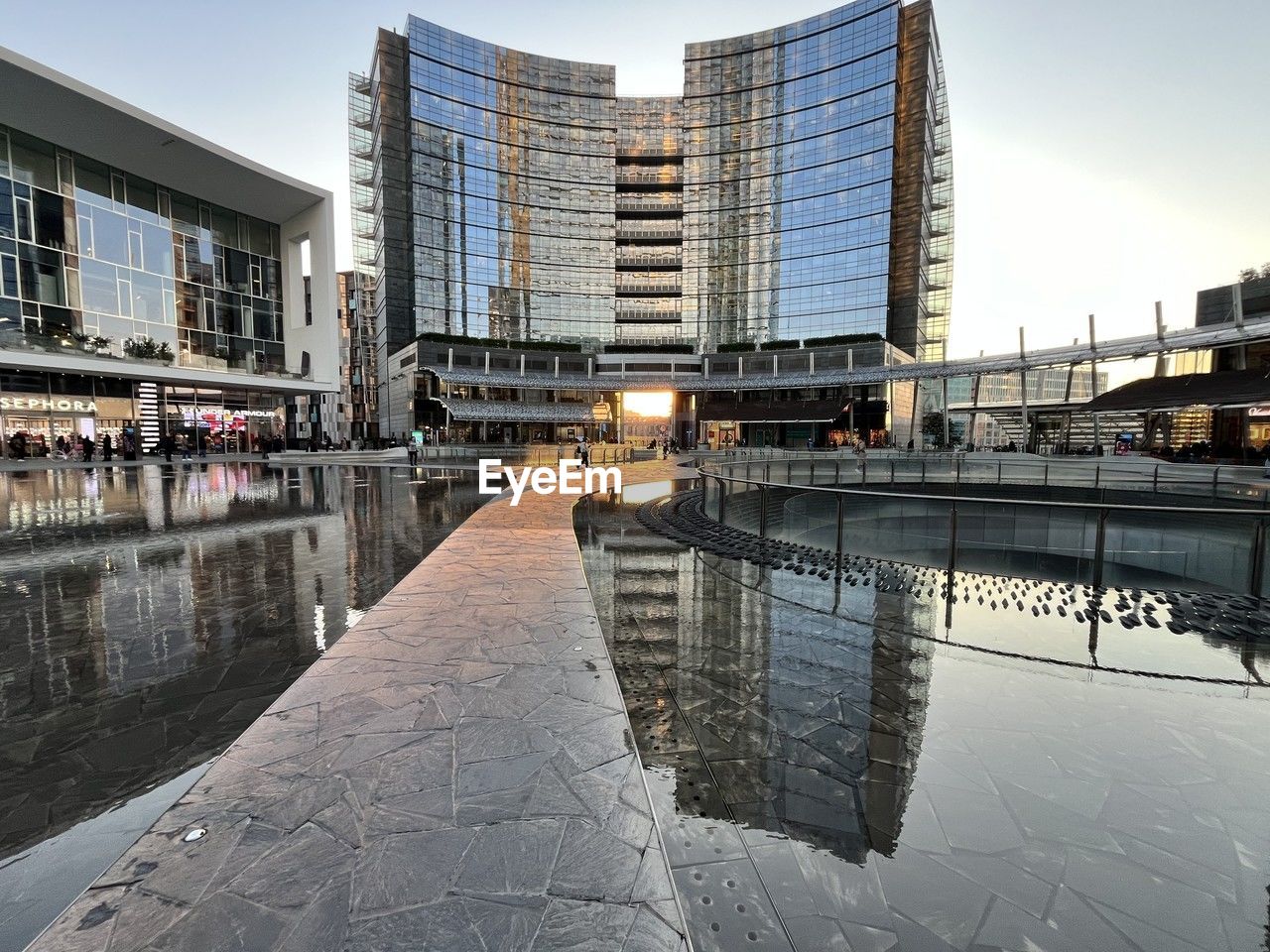 architecture, built structure, reflection, building exterior, city, urban area, water, cityscape, building, sky, downtown, landmark, nature, travel destinations, skyscraper, street, bridge, winter, office building exterior, tower block, city life, skyline, dock, travel, business finance and industry, landscape, outdoors, residential district, business, walkway, tourism, no people, waterway, river, urban skyline, metropolitan area, snow, transportation, waterfront, metropolis