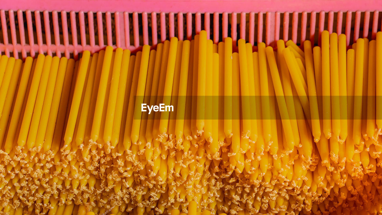 HIGH ANGLE VIEW OF FRESH YELLOW VEGETABLES IN CONTAINER