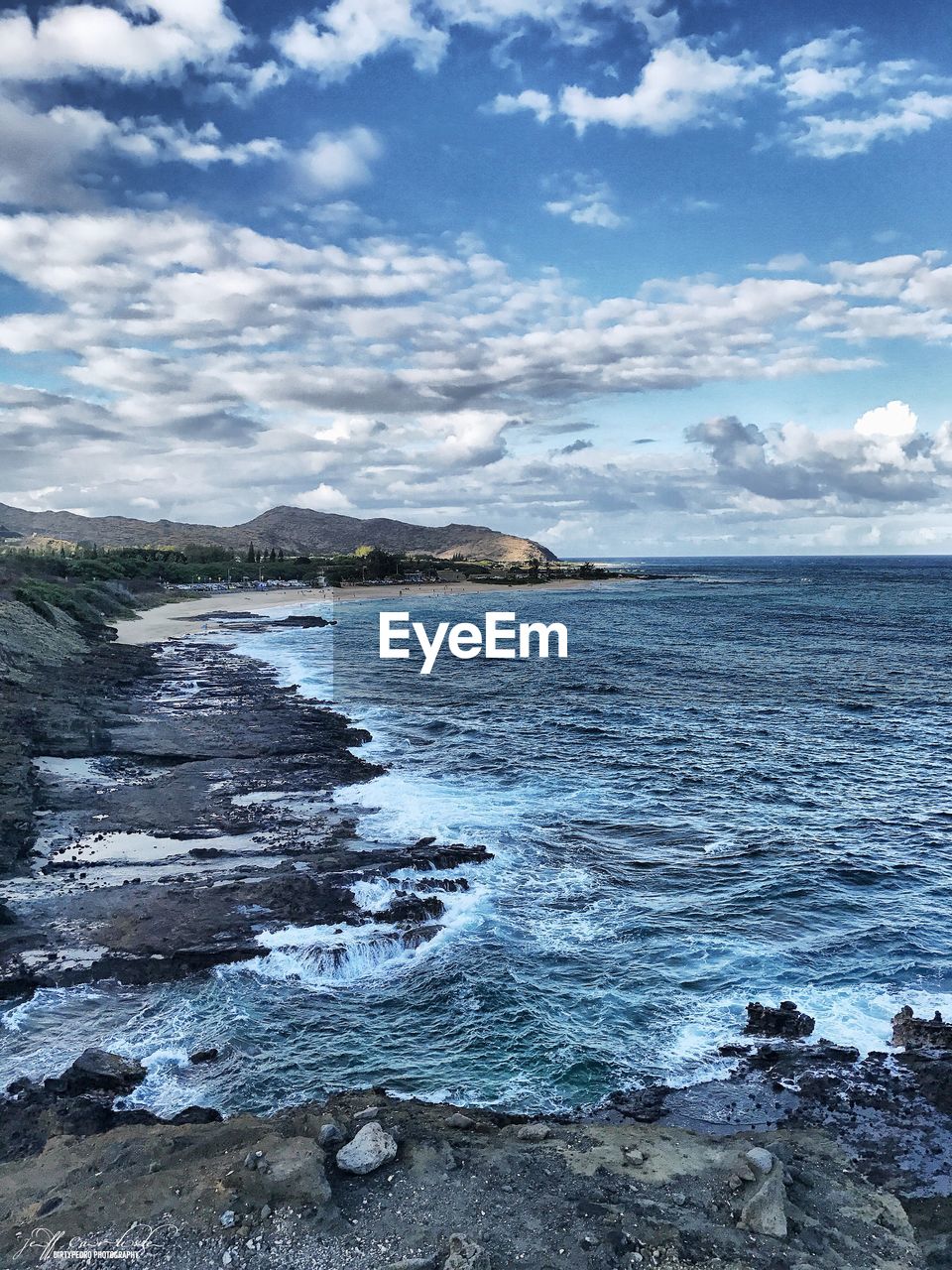 Scenic view of sea and cloudy sky