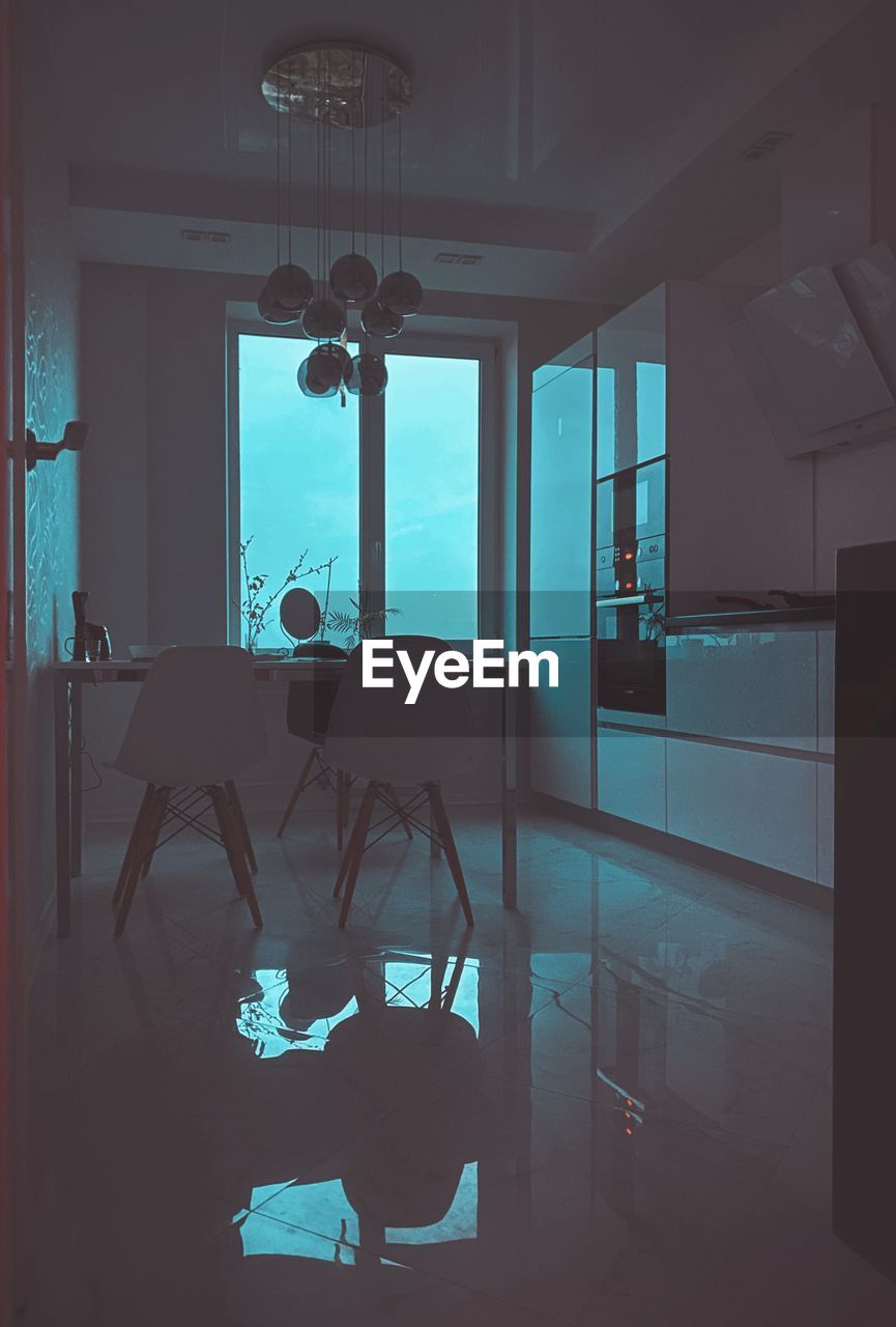 REFLECTION OF PEOPLE ON GLASS WINDOW