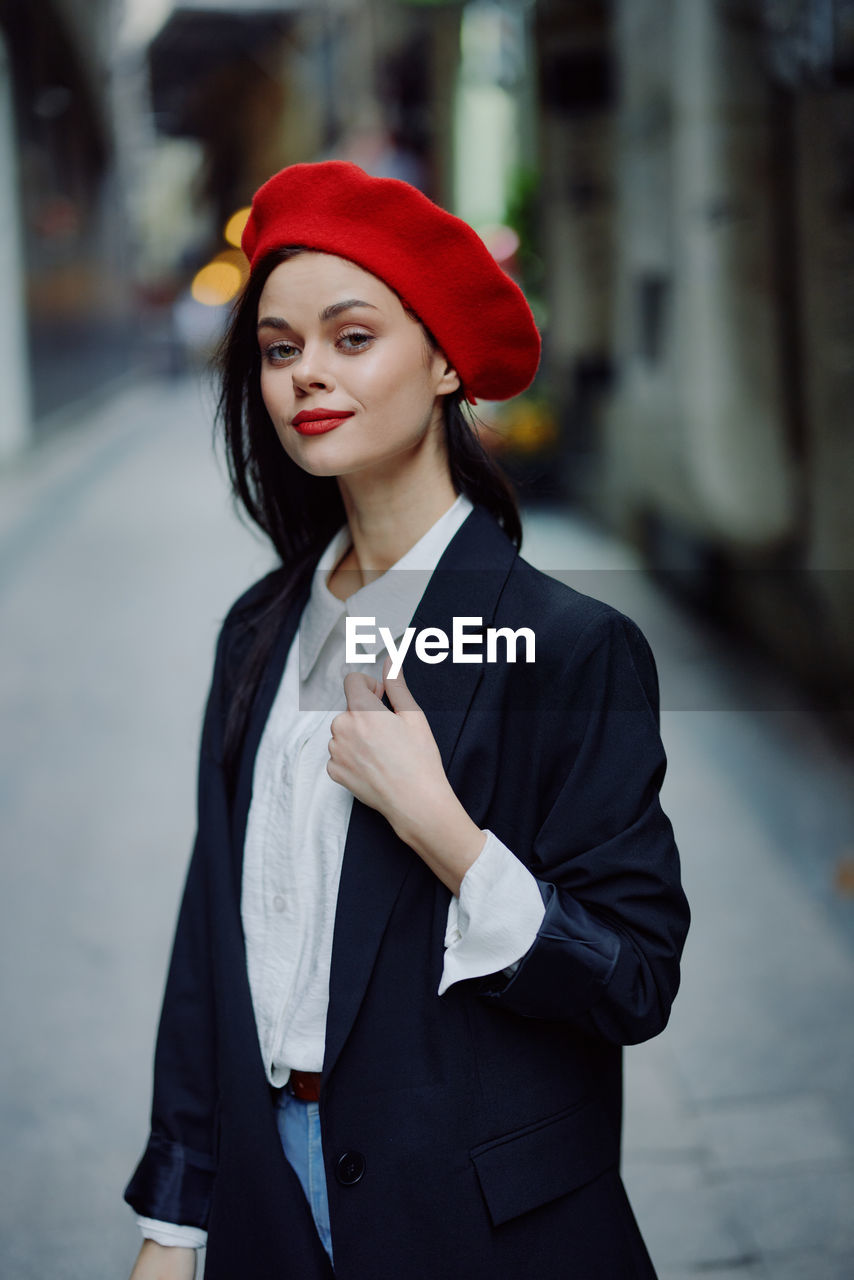 portrait of businesswoman standing in city